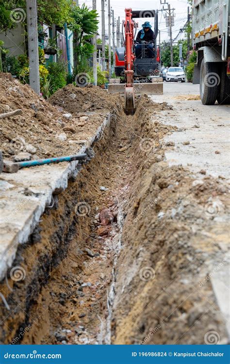 Digging Road before Install Pipe Water. Excavation Water Drainage at ...