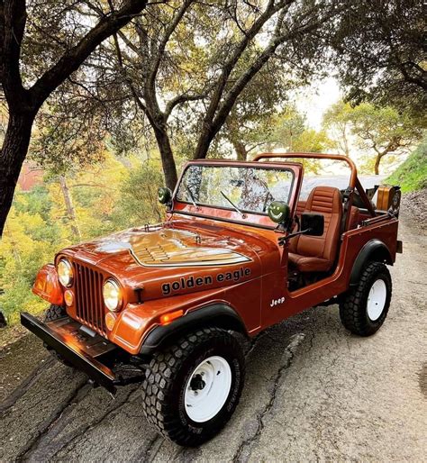 Orange Jeep Wrangler on a Dirt Road