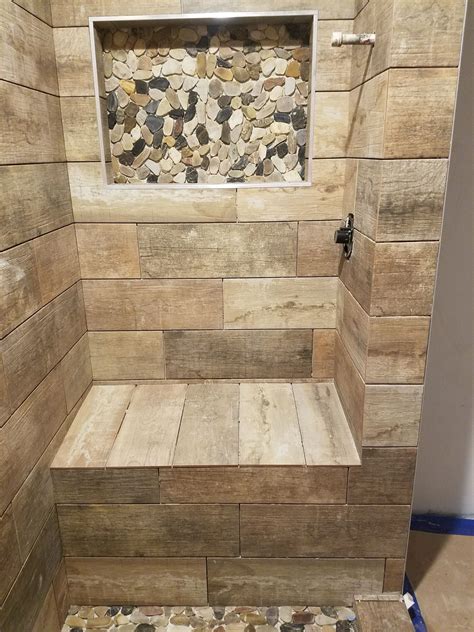 Wood Tile Shower Seat with River Rock Niche