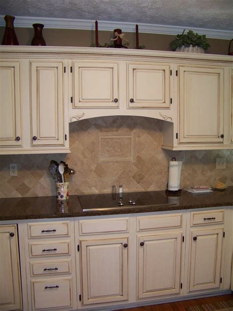 Cream Cabinets with dark brown glaze. | Antique white kitchen cabinets ...
