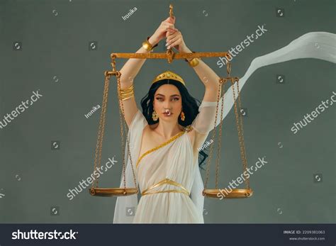 Woman Holding Balance Scale at Margaret Carlin blog