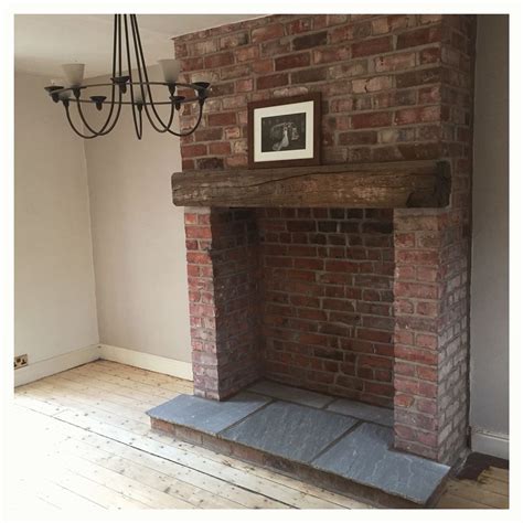 Exposed brick fireplace with indian stone hearth and reclaimed wooden ...