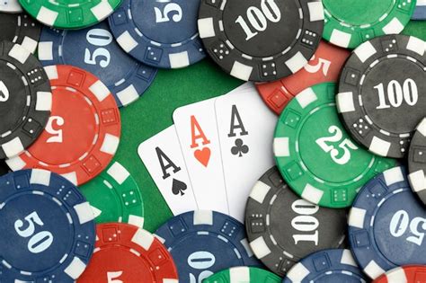 Free Photo | Casino tokens on green background with ace cards