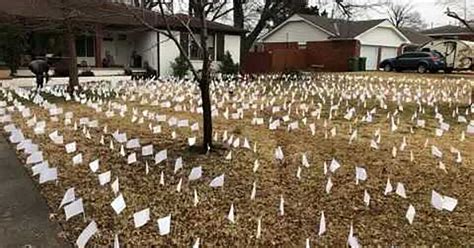 'Not just a number': Woman places flags in front yard to honor those ...