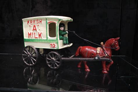 Lot - CAST IRON HORSE-DRAWN MILK WAGON TOY