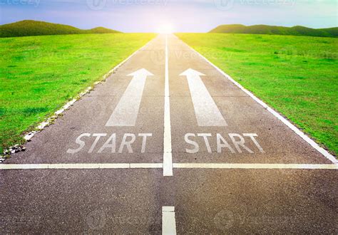 The starting point travels and road trip on a paved road lit by the sun ...