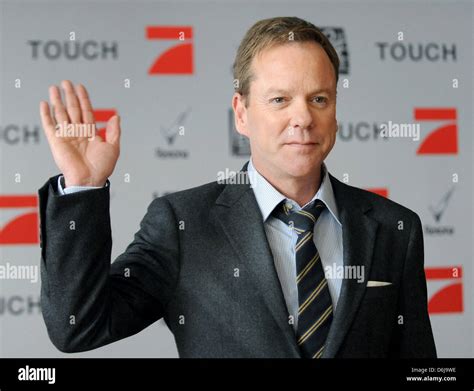 Canadian actor Kiefer Sutherland waves as he attends a photocall for ...
