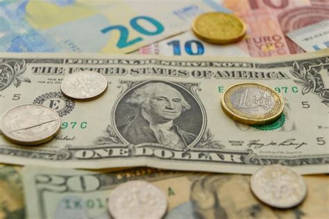 Premium Photo | Euro and us dollars coins and banknotes