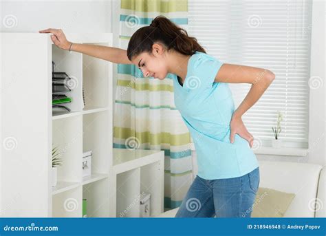 Woman Suffering from Backache at Home Stock Photo - Image of backpain ...