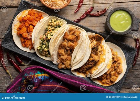 Different Types of Tacos Also Called Guisados on a Wooden Background ...