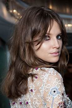 How To Style Middle Part Bangs With Hair by Middle Parted Bangs Why You Should Get Them How To Style Middle Part Bangs With Hair