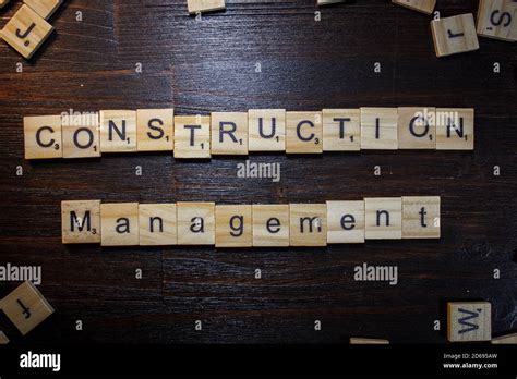 Word or phrase Construction Management made with scrabble letters on ...