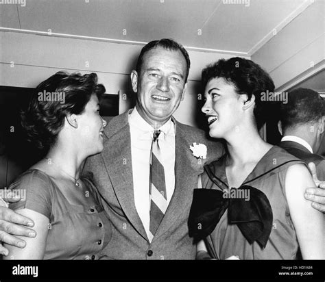 John Wayne, center, with daughters Melinda Wayne, (left) and Antonia ...