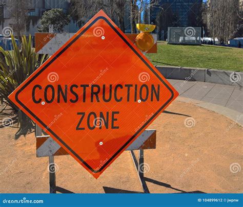 Orange Construction Zone Sign on Barricade Stock Photo - Image of ...