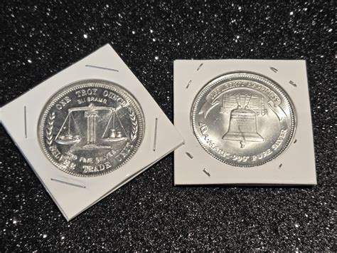 Lot (2) 1 oz .999 Fine Silver Rounds - Liberty Silver & A-Mark Trade ...
