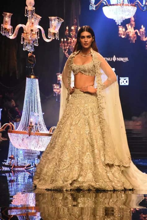 Kriti Sanon stuns on the runway in an ivory colour lehenga by designer ...