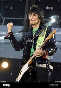 Rolling Stones guitar player Ron Wood rocks on the stage during the Stock Photo, Royalty Free ...