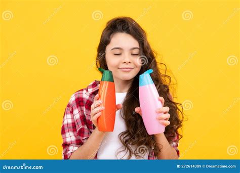 Teenage Girl with Shampoos Conditioners or Shower Gel. Kids Hair Care ...