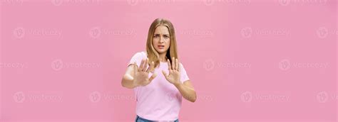Stay away from me. Intense worried and displeased woman being victim of sexual harassment ...