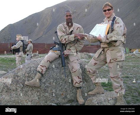 US Navy Master-at-Arms 1st Class shake hands with Chief Engineman after ...