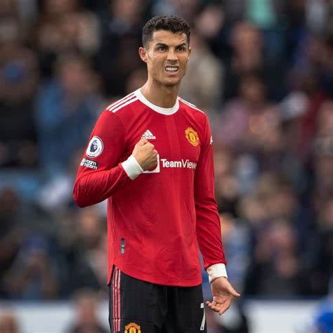 Download Cristiano Ronaldo striking a pose on the field | Wallpapers.com