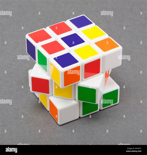 Rubik's cube (white, red, blue, orange, green, and yellow) on gray ...