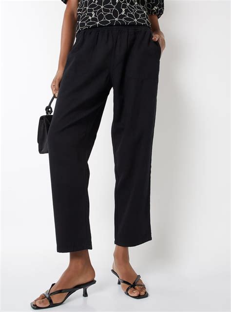 Buy Women Textured Peg Trousers Online at just Rs. 1299.0 ...