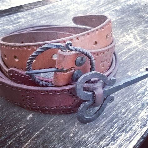 And finished.. Two belts with hand forged buckles. Upper one is bee ...