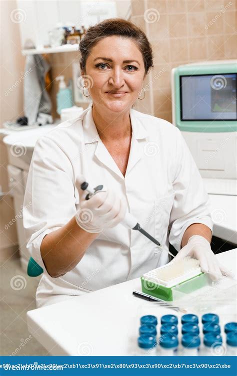Laboratory Assistant with Dispenser in Laboratory Doing Blood Test Analysis. Medical Equipment ...