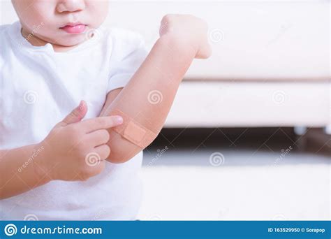 After Mother Applying Adhesive Plaster Bandage On Childen Kid Arm Wound Stock Photo - Image of ...