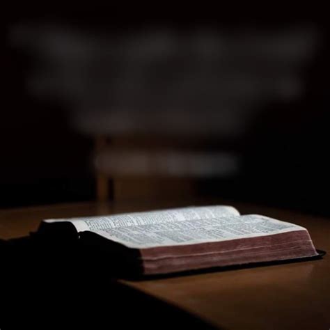 Open Bible on Wooden Table