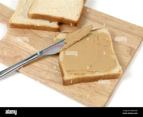 Peanut butter spread on white bread Stock Photo - Alamy