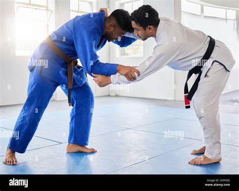 Karate, martial arts and men fighting in dojo for sports and health ...