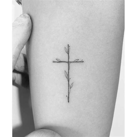 Flower cross tattoo located on the inner arm, | Small tattoos, Cross ...
