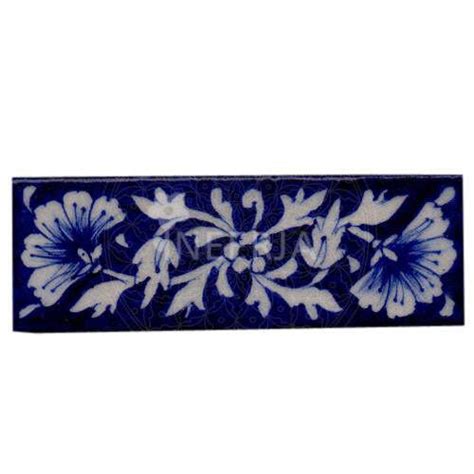 White design on Blue base Tile – NEERJA INTERNATIONAL INC