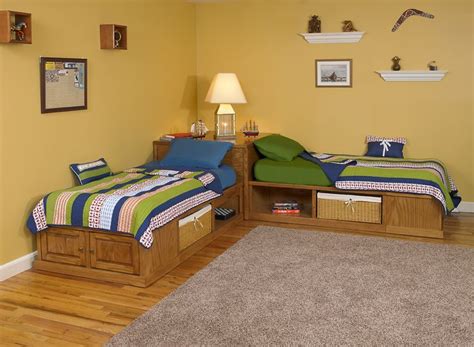 two twin beds in a bedroom with yellow walls