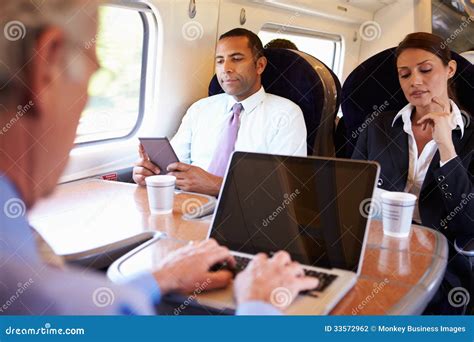 Businessman Commuting To Work on Train and Using Laptop Stock Photo - Image of occupation, book ...