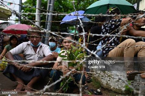 A released prisoner, right, is welcomed by her colleague after she was released from Insein Prison Sunday, Jan. 4, 2026, in Yangon, Myanmar. (AP Photo/Thein Zaw)