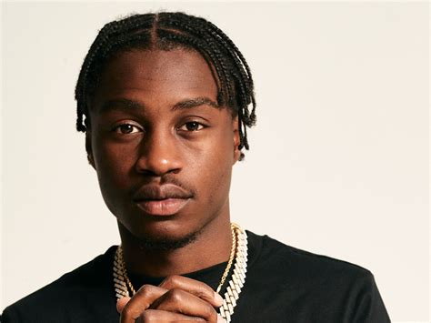 Lil Tjay 2026: Girlfriend, net worth, tattoos, smoking & body facts ...