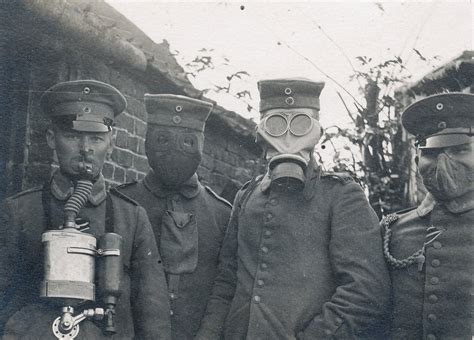 German soldiers wearing four different types of gas masks that were ...
