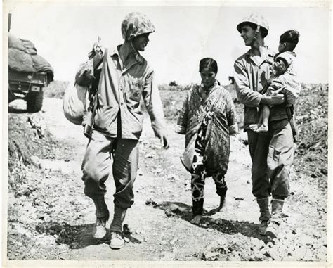 U.S. Marines with refugee mother and child, Okinawa, Japan, 1945 | The ...