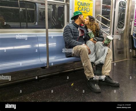 Public display of affection on the E train in the New York subway on ...