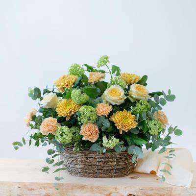Mixed basket in warm shades and greens: Order Flowers Online ...