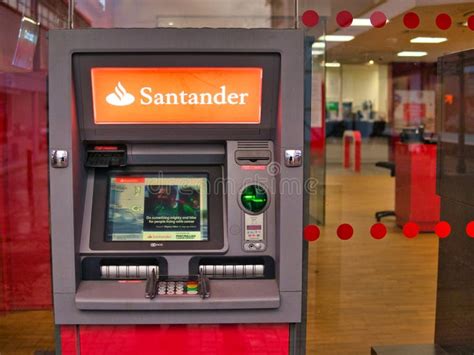 A man walks past an automated teller machine (ATM) outside Bank of America Corp. headquarters in Cha Vector Art