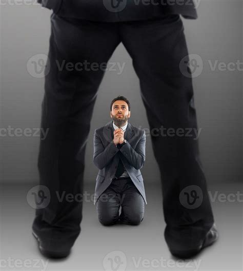 Business man on his knees praying not to be dismissed 24043468 Stock ...