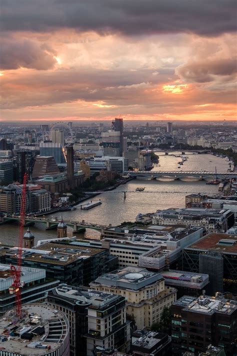 Download wallpaper 800x1200 river, bridge, buildings, city, sunrise ...