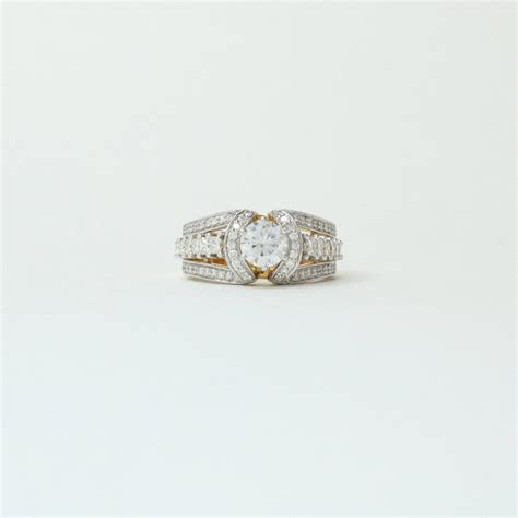 Chanel 0.69 Pointer Round Moissanite Ring | Fiona Diamonds