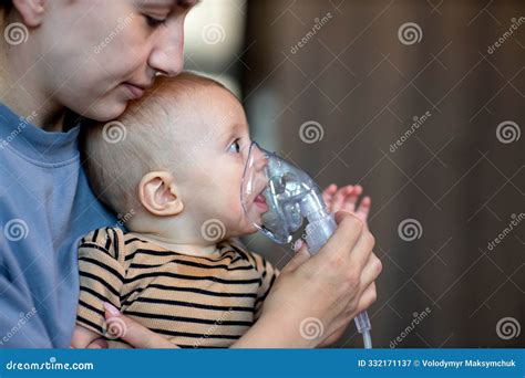 Mom Giving Nebulizer Breathing Treatment To Sick Infant Baby at Home ...