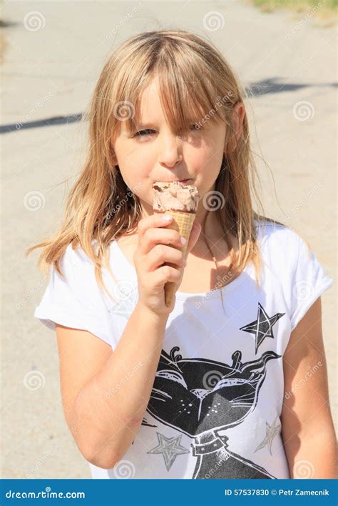 Girl licking ice-cream stock photo. Image of white, hairy - 57537830