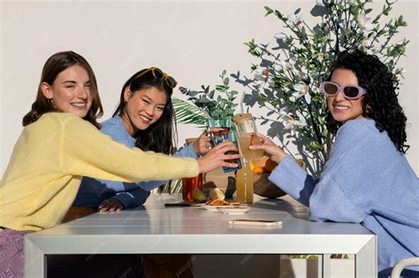 Premium Photo | Medium shot women drinking kombucha